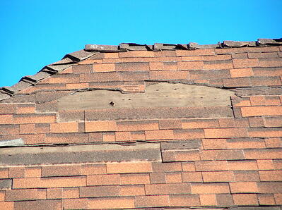 damaged asphalt shingles